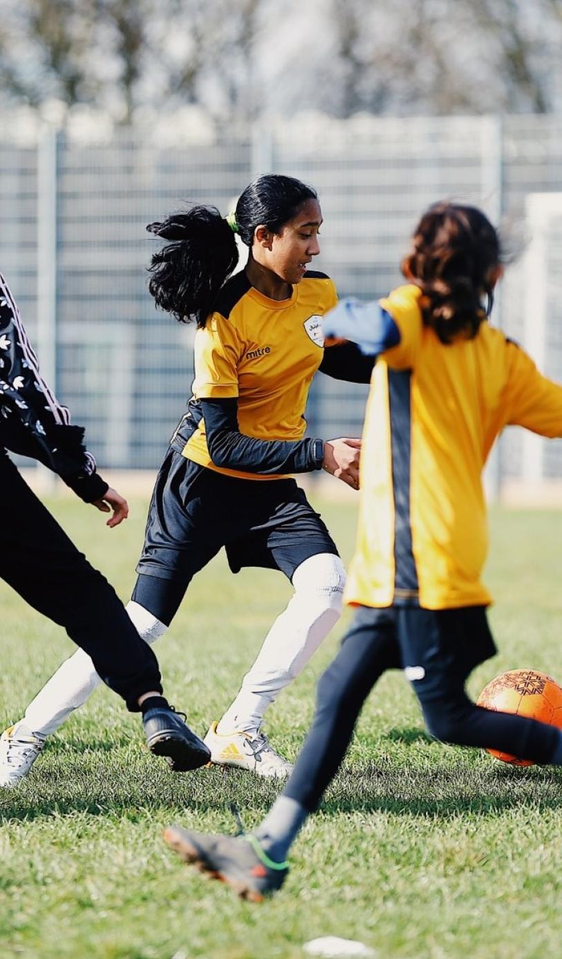 Young adults play a Go! London funded football match