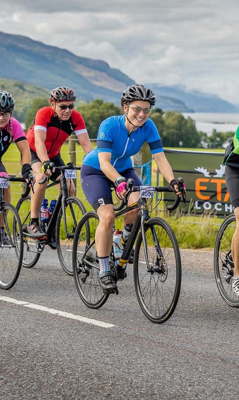 Participants riding along side Loch Ness