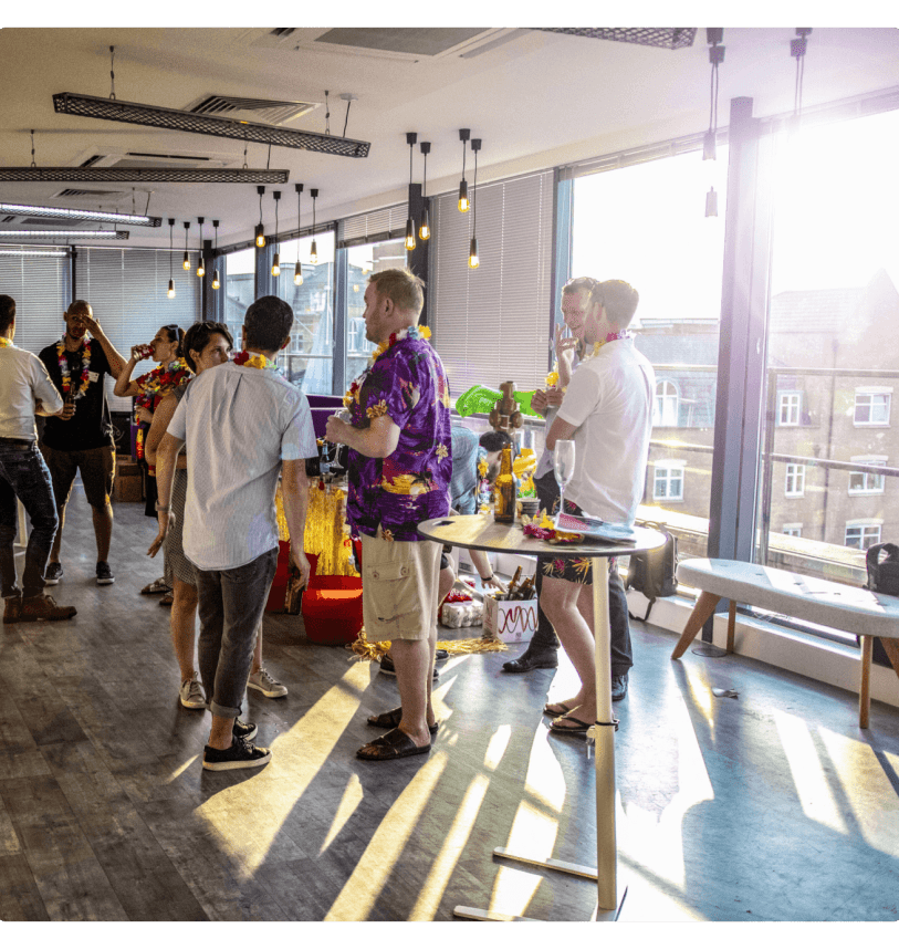 House of Sport employees in conversation in the sunshine